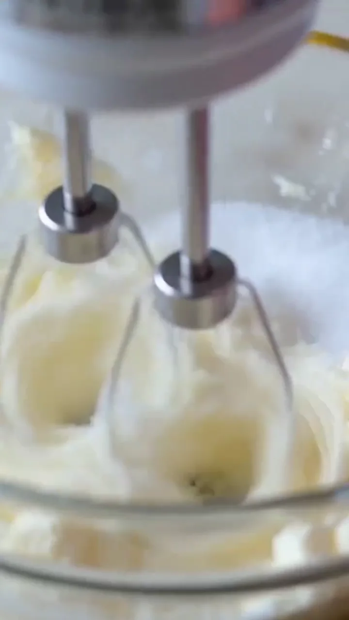 Cream cheese filling mixed until smooth for mini lemon cheesecakes