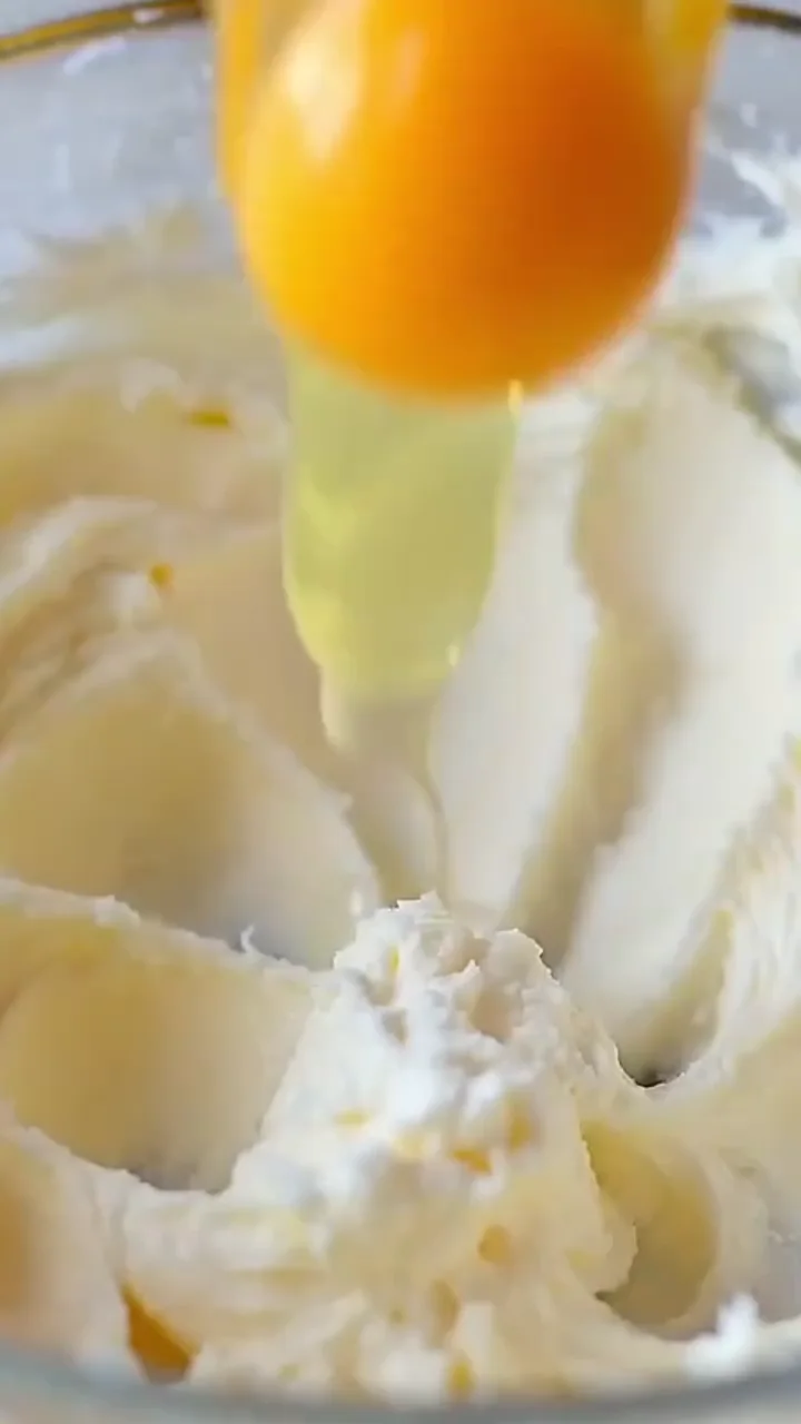 Eggs and lemon ingredients added to cheesecake filling